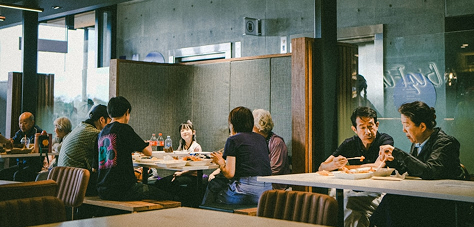 Calm restaurant dining room with guests