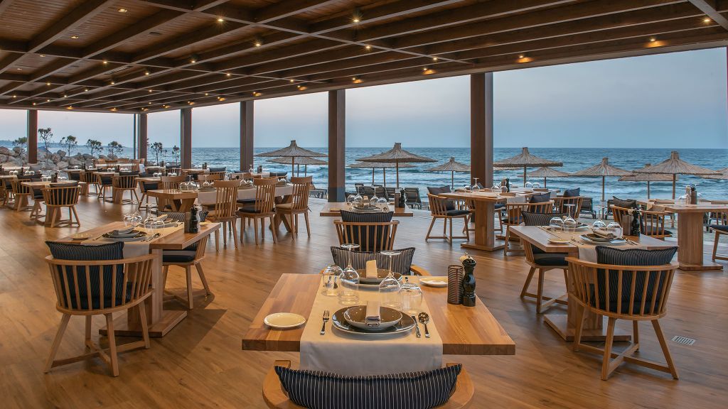 Table spread with Mediterranean dishes and shared dining