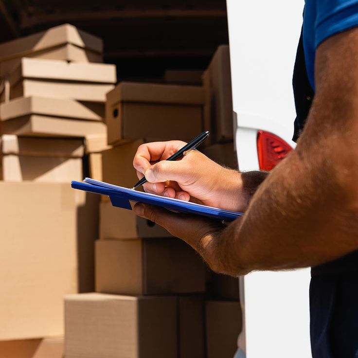 Delivery person moving supply boxes